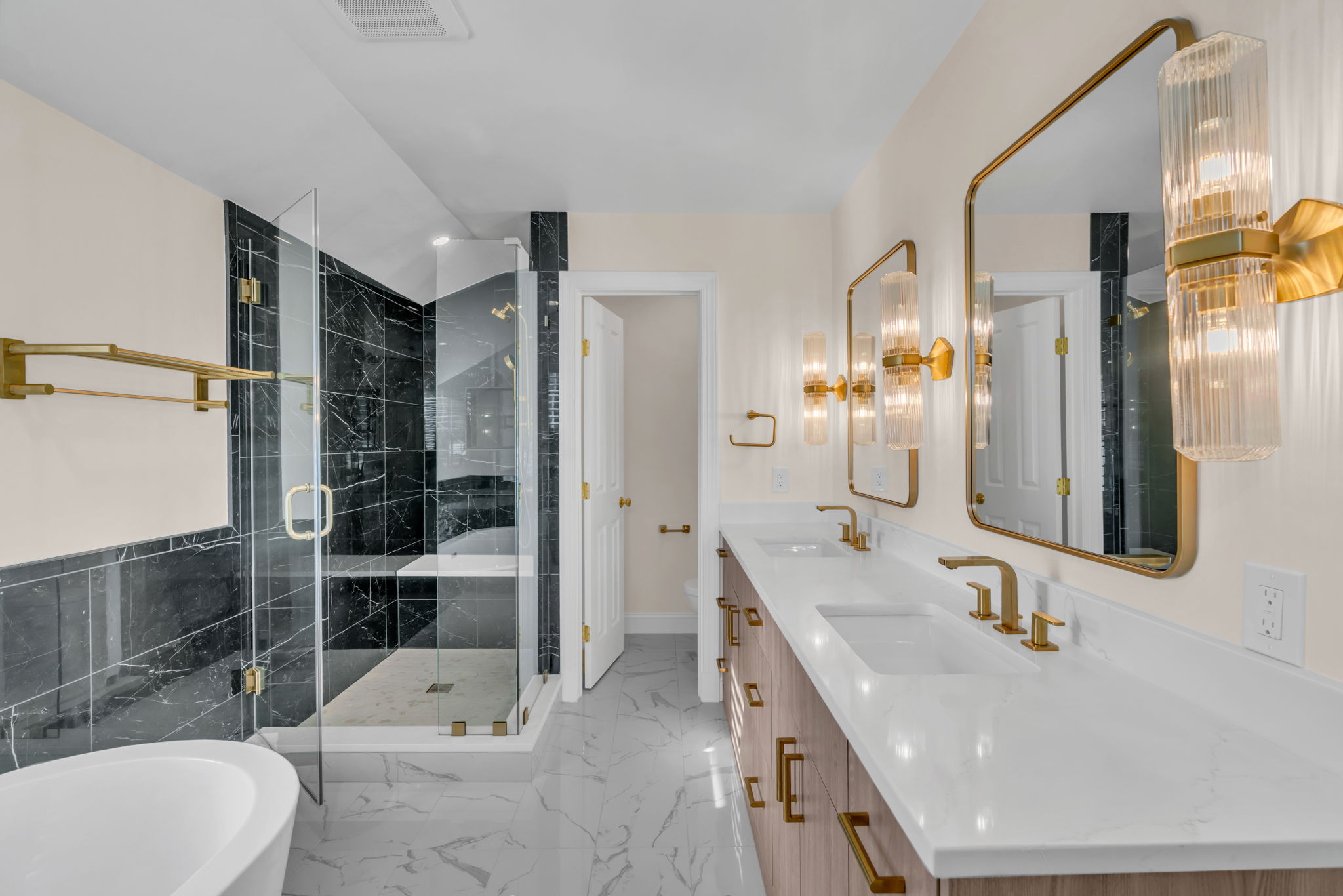Chic Luxury Bathroom Transformation with Brass and Marble Touches