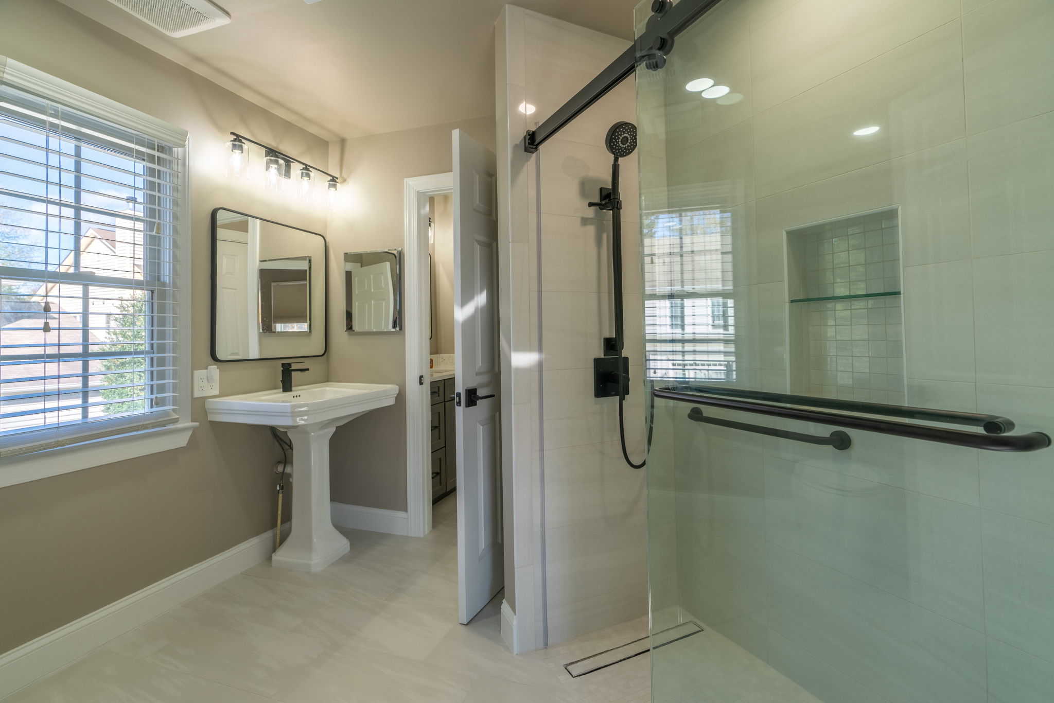 Sleek and Stylish: White Bathroom Makeover with Black Details